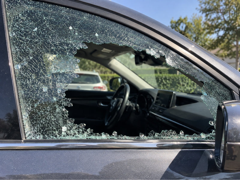 Shattered car side window before door glass replacement